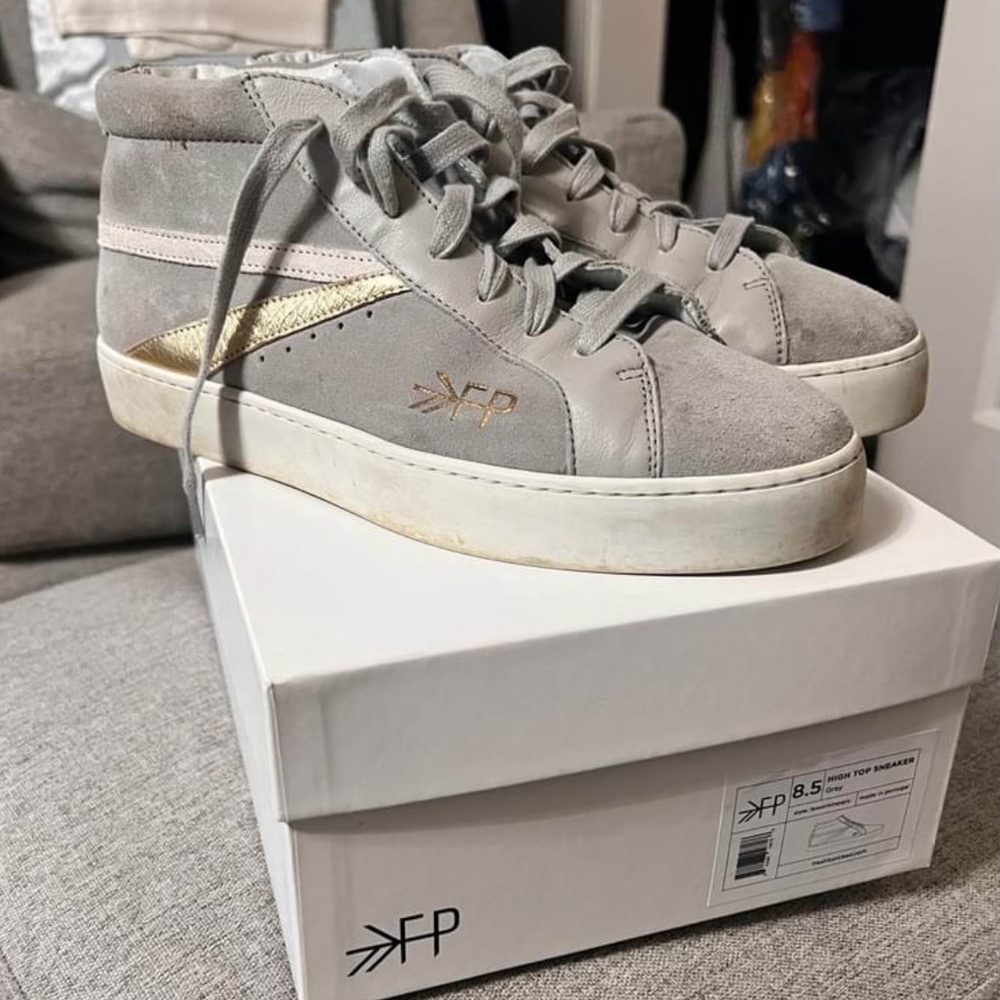 Freshly picked hard to find hightops with gold and white strip!